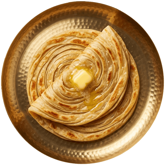 Seen from above: two lachha parothas with a pat of butter on a brass plate