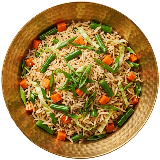 Seen from above: veg fried rice with carrot, beans, cabbage and spring onion in a brass bowl